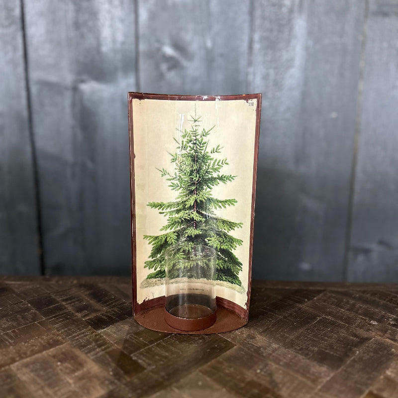 Decorative item with a green tree design on a wooden surface and dark wooden panel background