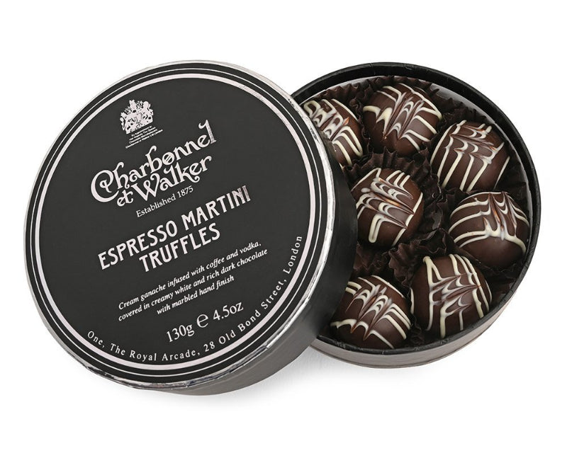 A tin of Charbonnel et Walker Espresso Martini Truffles, showing dark chocolate truffles with a marbled finish inside.