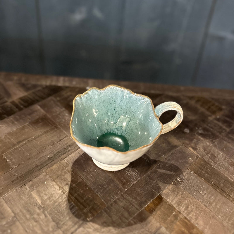 Ceramic cup with a textured surface on a wooden table