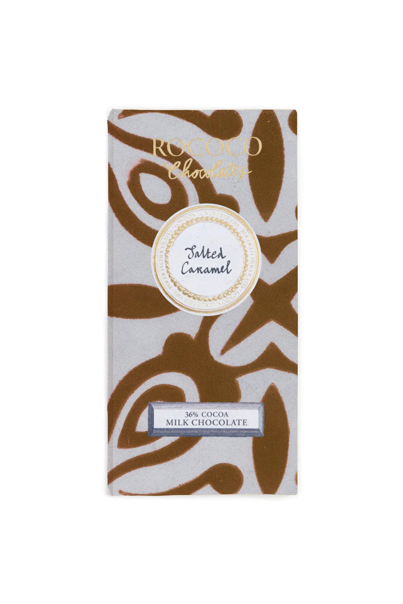 Packaging of Rococo Salted Caramel Milk Chocolate Bar with a patterned design in brown and white colors and a label displaying the product name and weight.