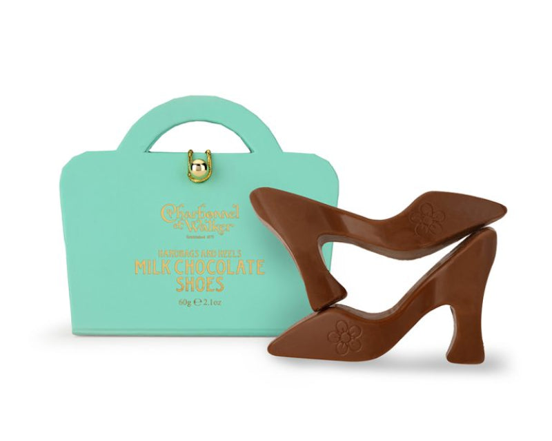 Chocolate shoes with a mint green box on a white background