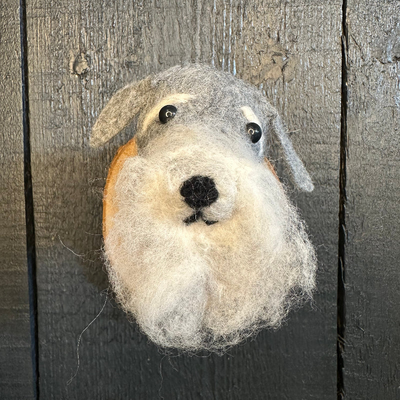 Felted animal toy on a wooden surface